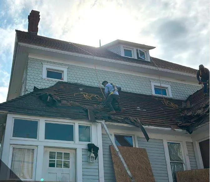A roofer repairing a roof