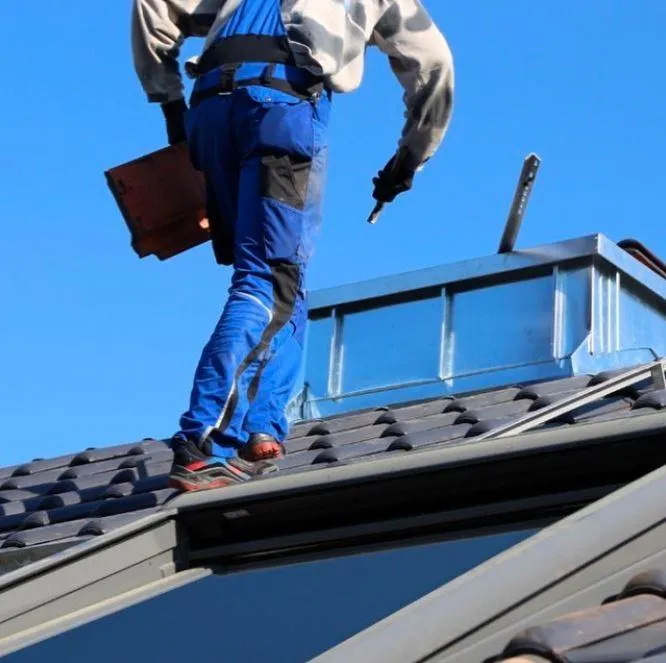 man doing a roof inspection