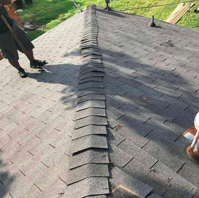 roofers in the process of inspecting a roof