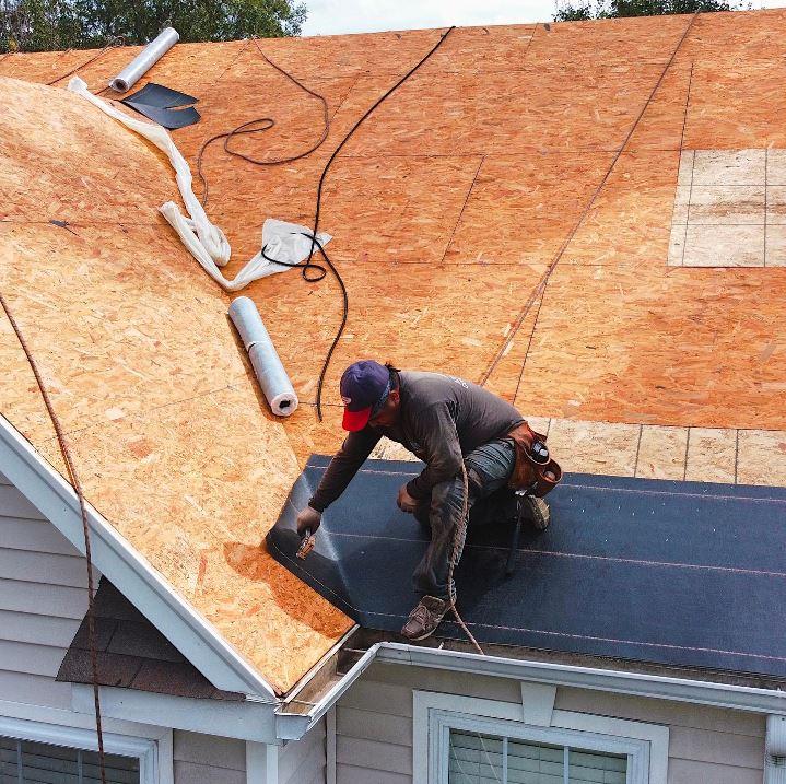 a roofer installing a new roof