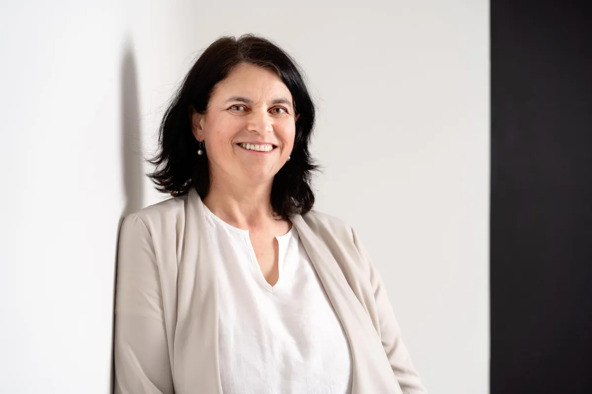 Gabrielle Taylor, compassionate relationship coach for empathic women, smiling warmly in a peaceful, professional setting.