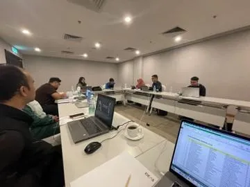 architectural photography of building with people in it during nighttime