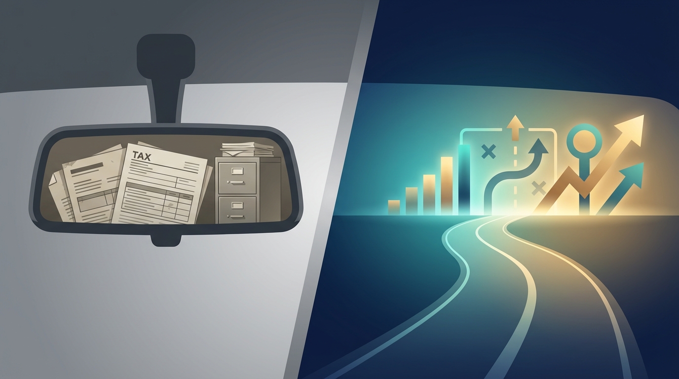 looking through car windshield, left side rear view mirror with US tax returns, right side is road leading to many business decision paths