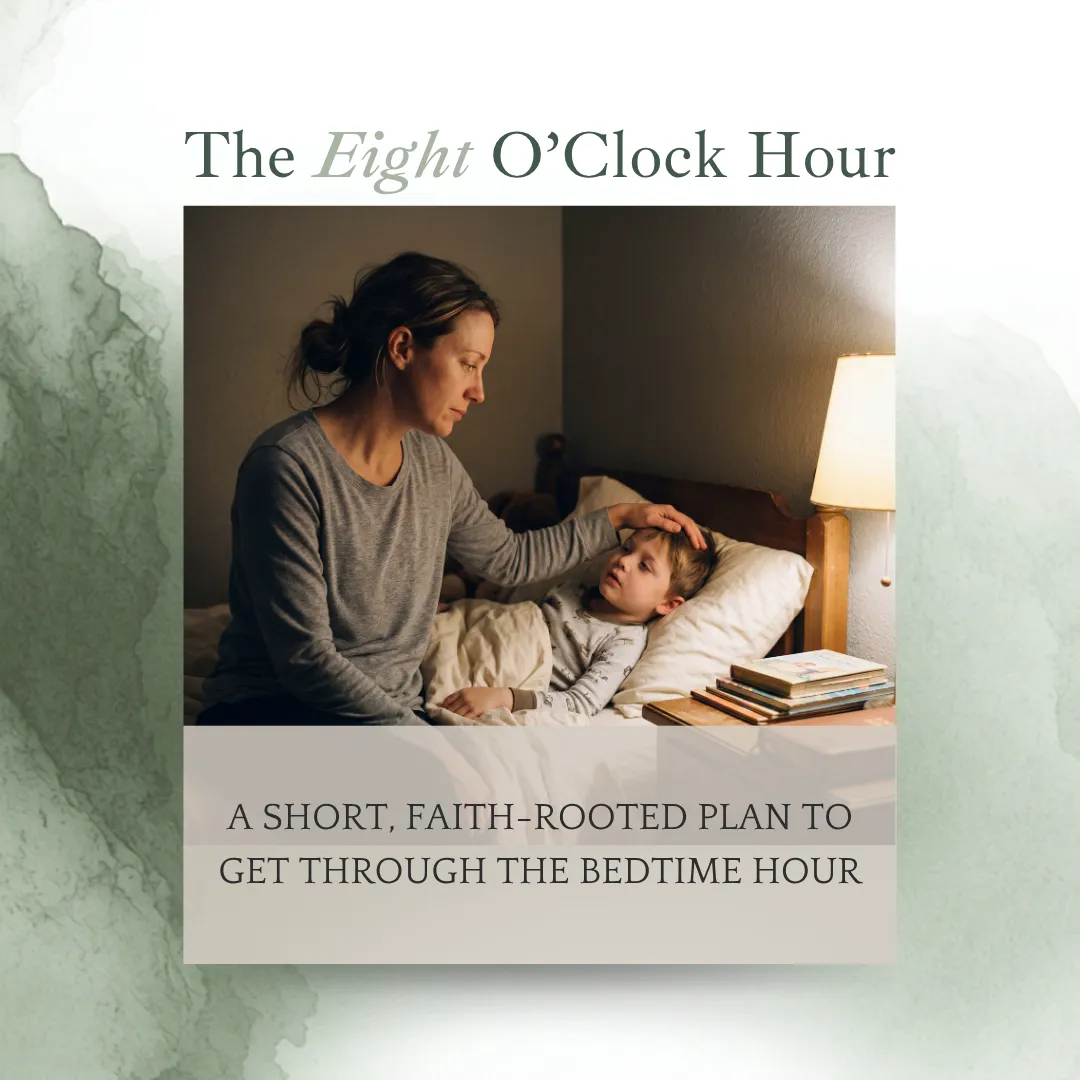 Tired mom sitting next to a son in his bed with soft dimmed light