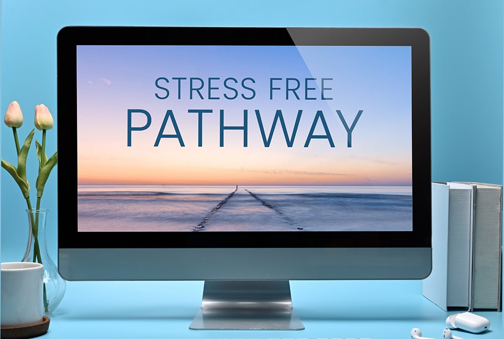 A blue boat rests on the grassy shore.