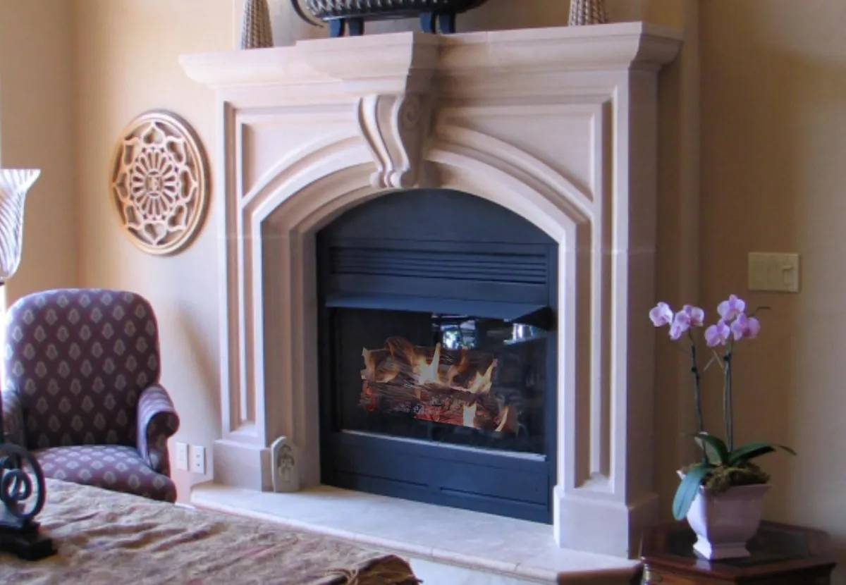 The classic Oxford fireplace, showcasing a traditional Tudor arch, an ornate central keystone, and a substantial stone mantel.