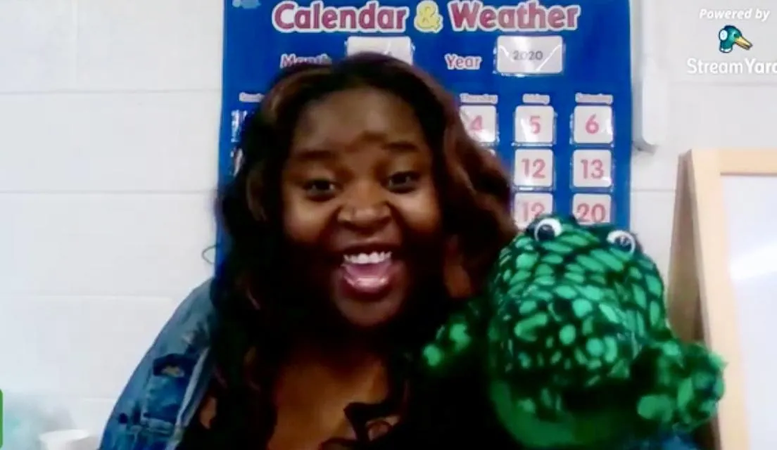 Jelly Malenga, shown using an alligator puppet during circle time to engage young children in interactive and playful learning activities