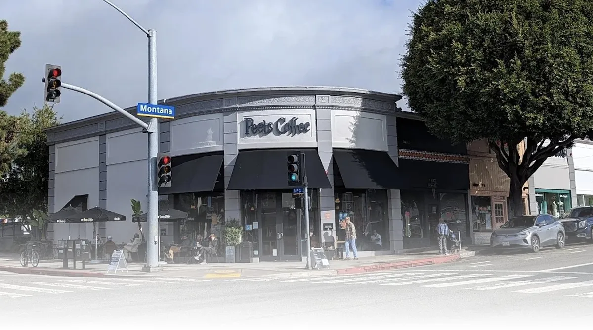 Exterior of Peet’s Coffee at 1401 Montana Avenue in Santa Monica, California, showing the corner storefront, outdoor seating with customers, and the Montana Avenue street sign.