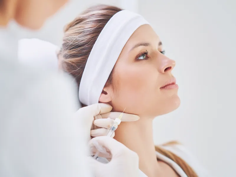 Close-up of a woman receiving a Juvéderm® injection for facial volume and wrinkle treatment
