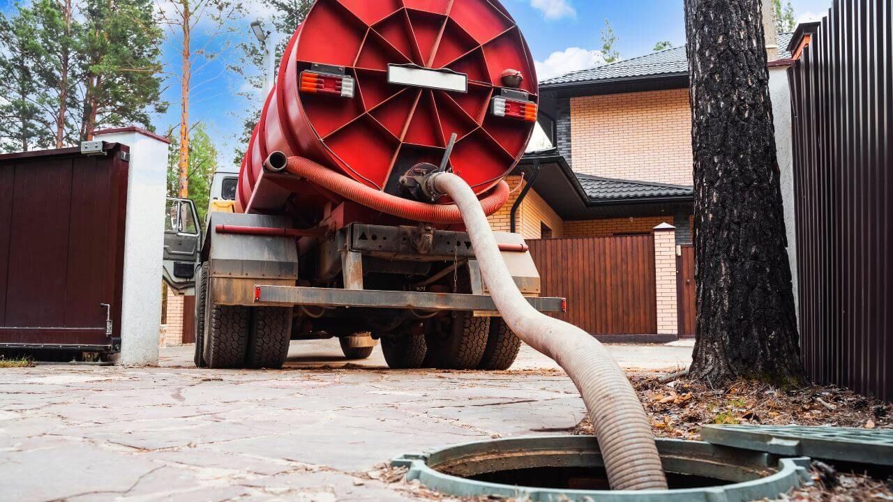 Septic truck pumping out a septic tank