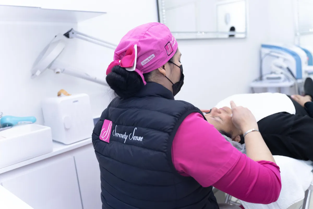 people swimming on the river near the red and brown concrete building during daytime
