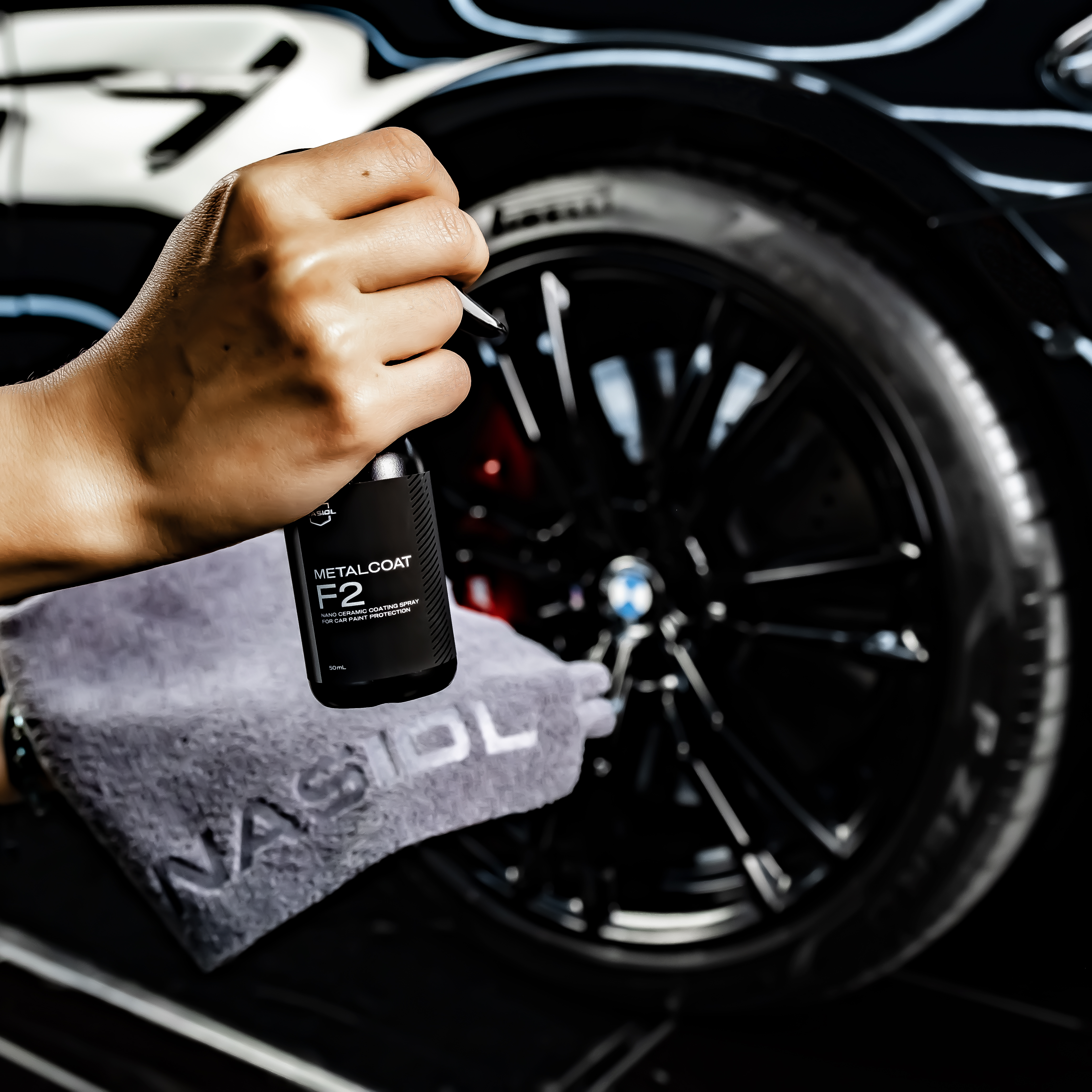 a person in a lab coat holding a green container
