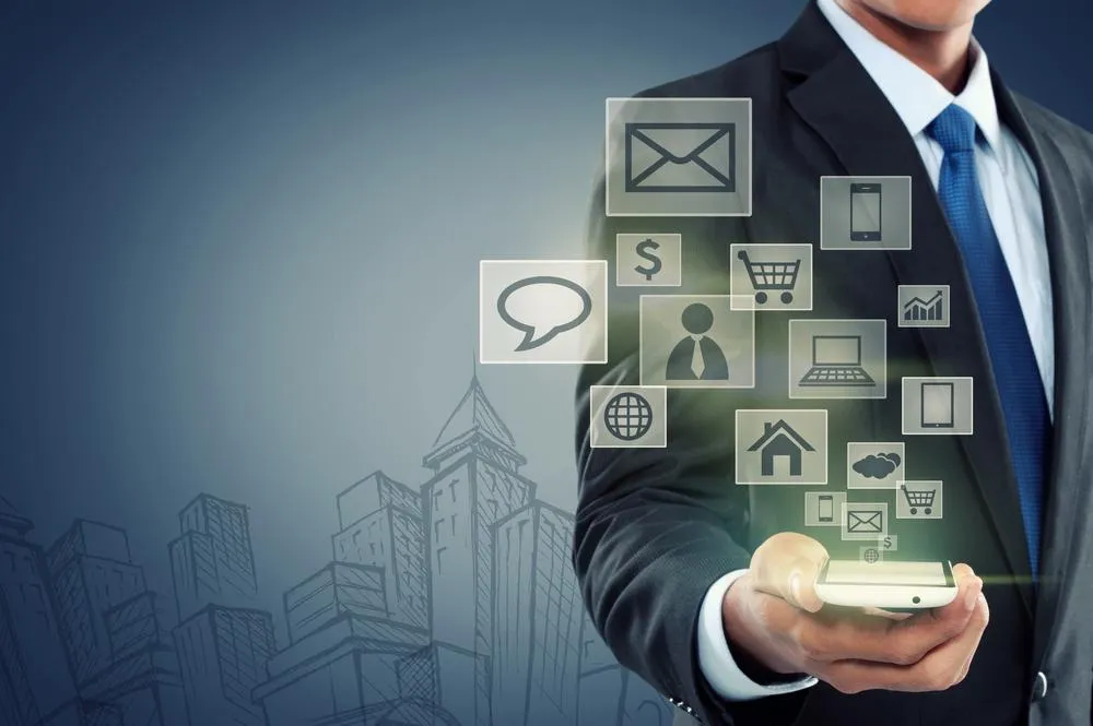 Rolling green hills with trees and a distant tower.