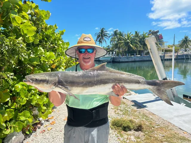 Captain Rabbit Keene with a client's catch on a Drift South offshore fishing charter
