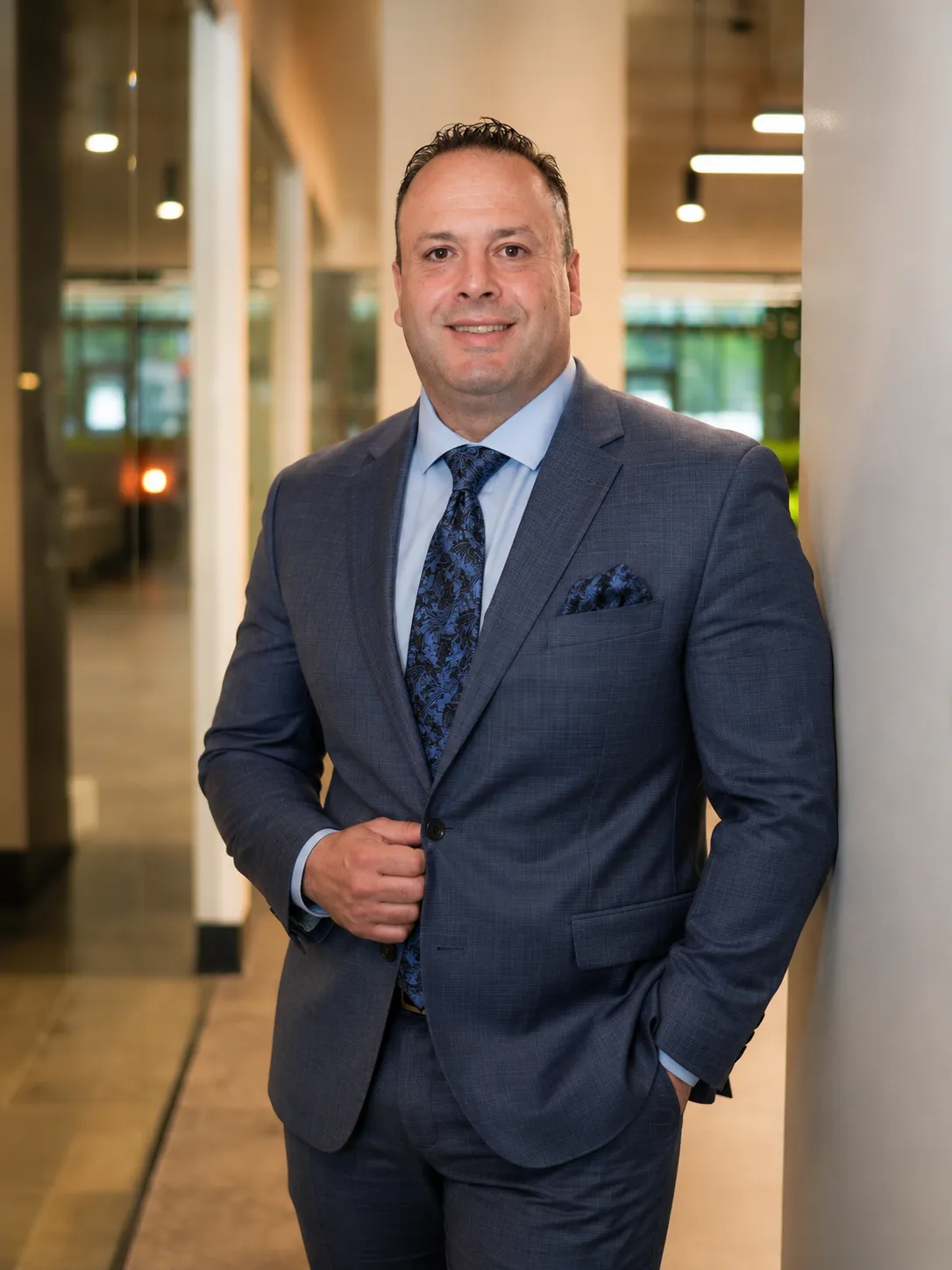 Andreas Andreanidis in a navy suit