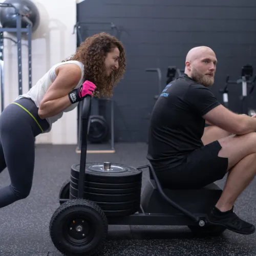 Client pushing sled at Stable Strength Private Studio