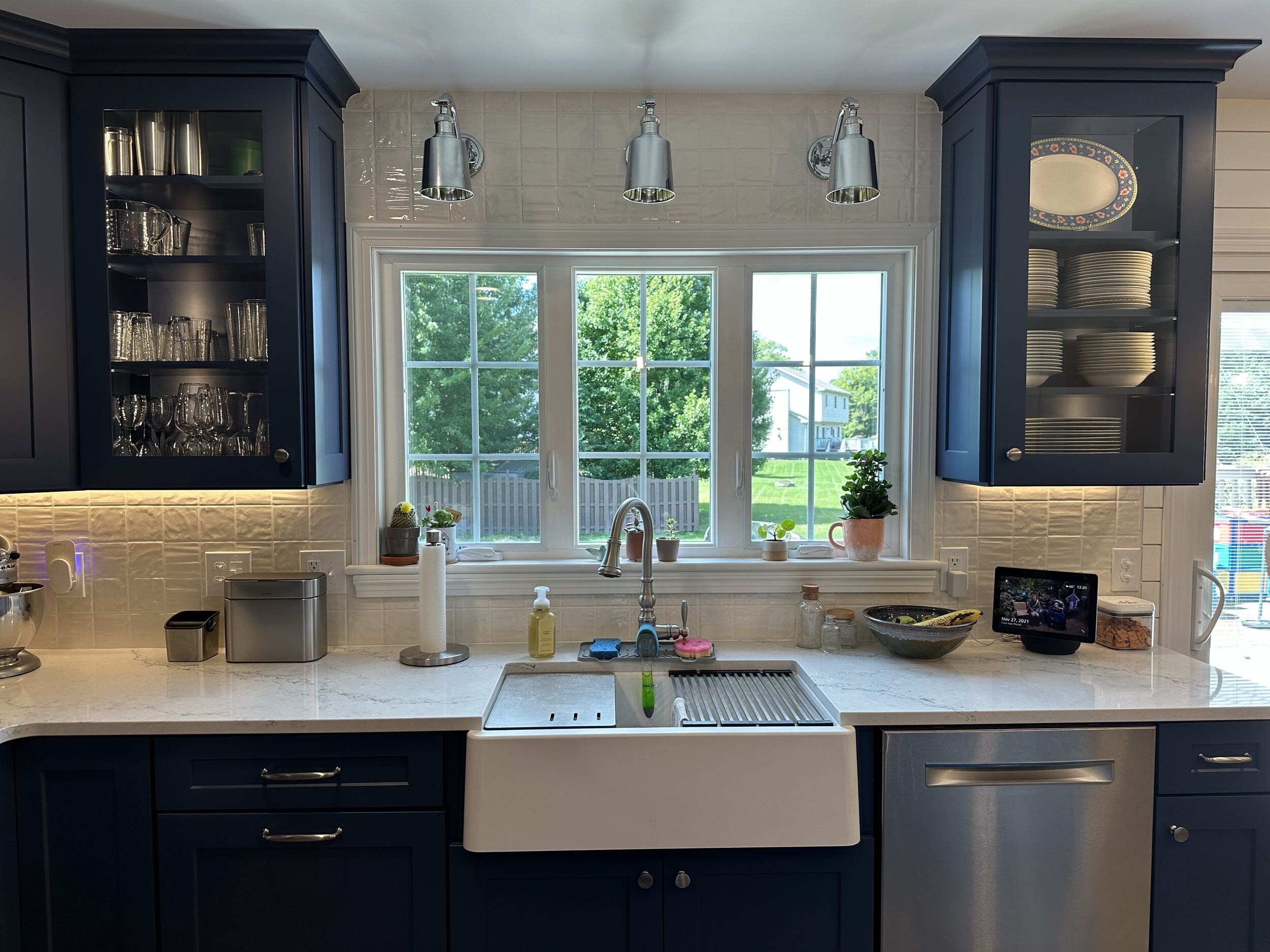 turned on pendant lamps above kitchen island