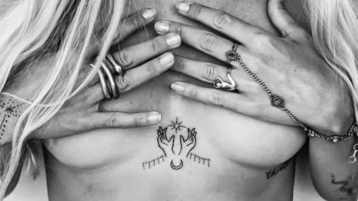 hand-poke-tattoo-sternum-symbol-bude