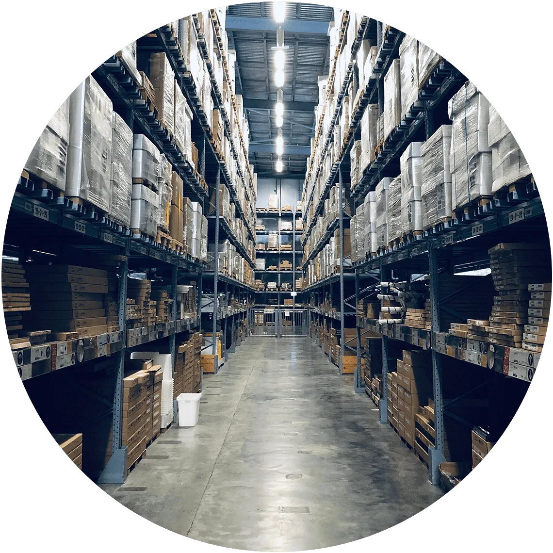 Organized warehouse with tall racks of packaged goods, highlighting inventory management and streamlined storage solutions.