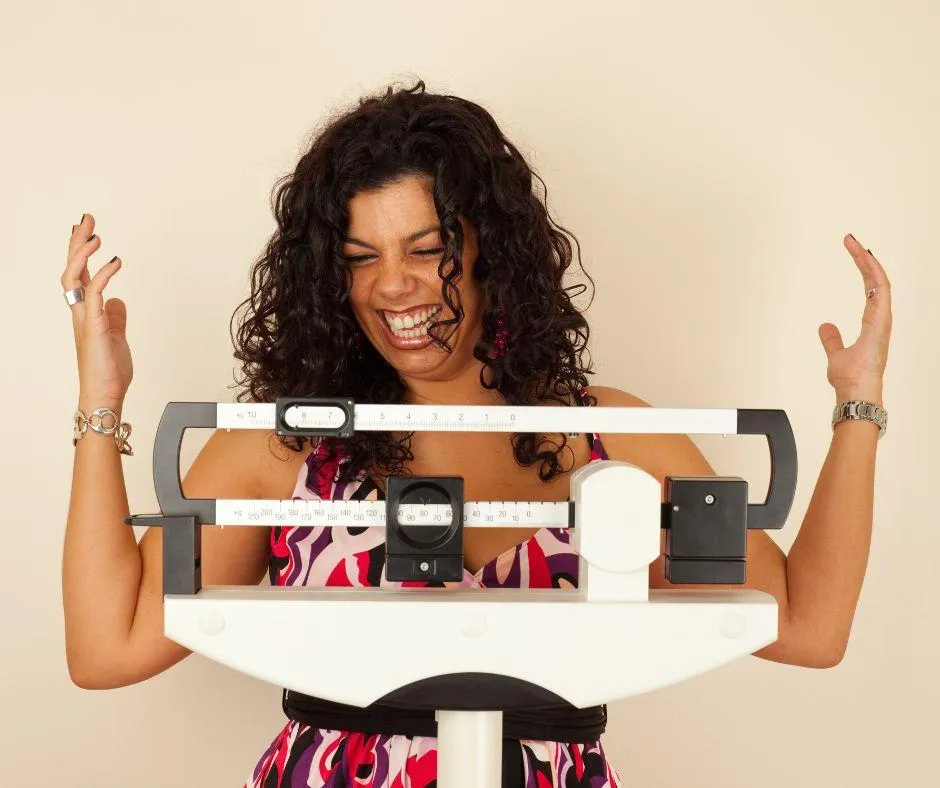 Happy woman loses weight
