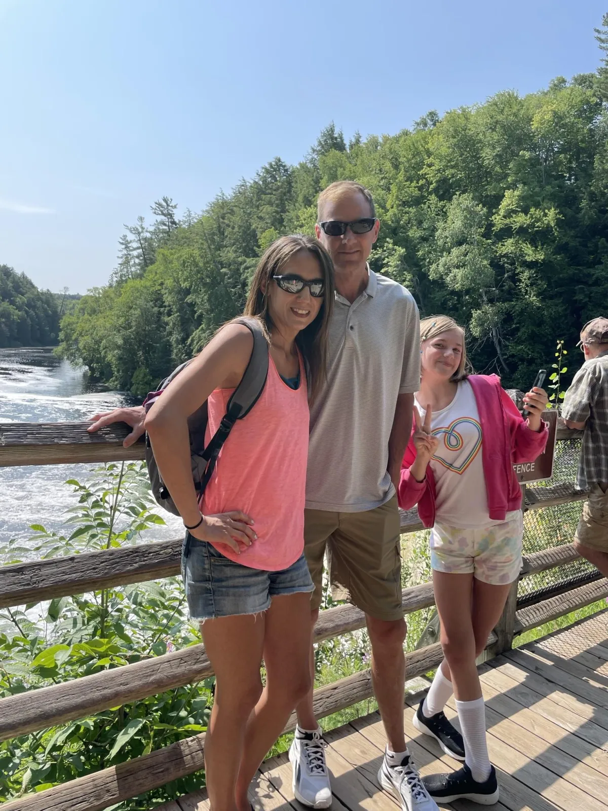dark haired woman with pink shirt