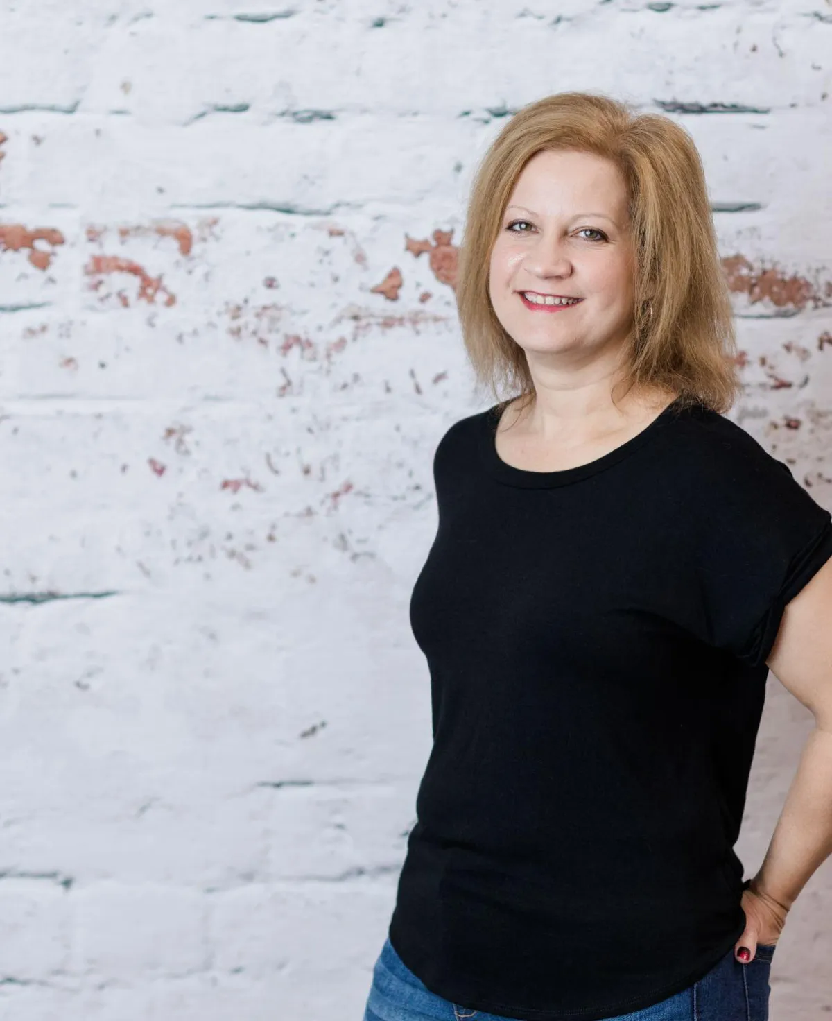 woman in black shirt smiling