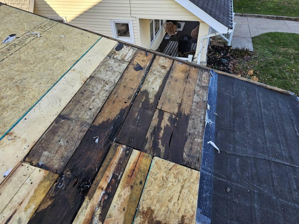 Severely water-damaged roof decking with OSB replacement in progress in Painesville, Ohio by Rockstar Roofing