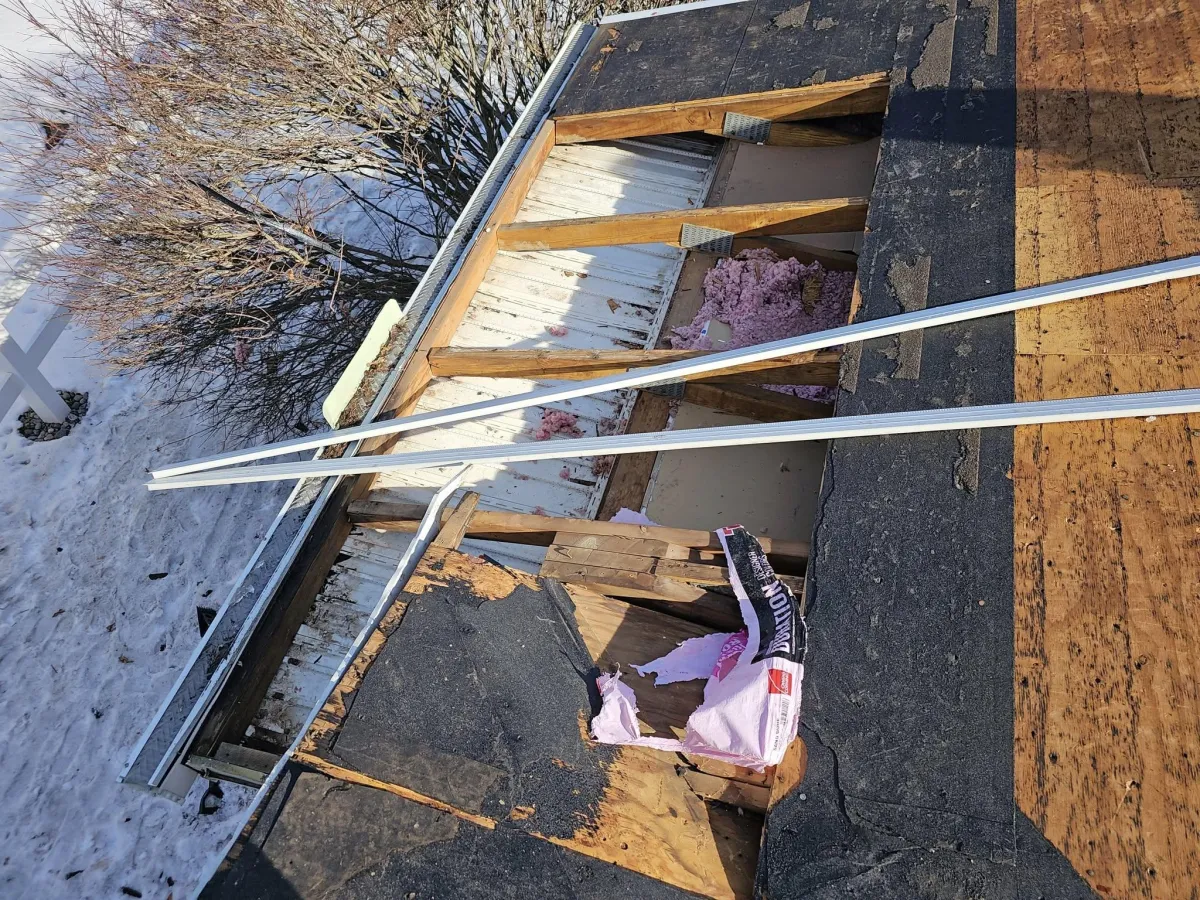 Aged roof decking with exposed ridge gap during full roof tear-off in Chagrin Falls, Ohio by Rockstar Roofing
