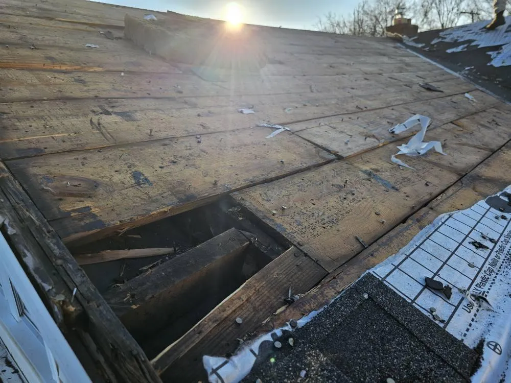 Severe roof decking damage with exposed rafters and missing sheathing in Mayfield Heights, Ohio – emergency repair by Rockstar Roofing