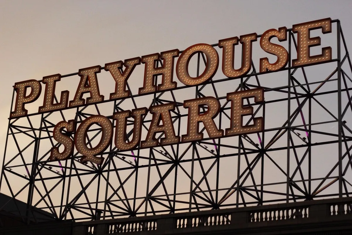 The illuminated Playhouse Square sign in Cleveland, Ohio, showcasing the city’s renowned performing arts district.