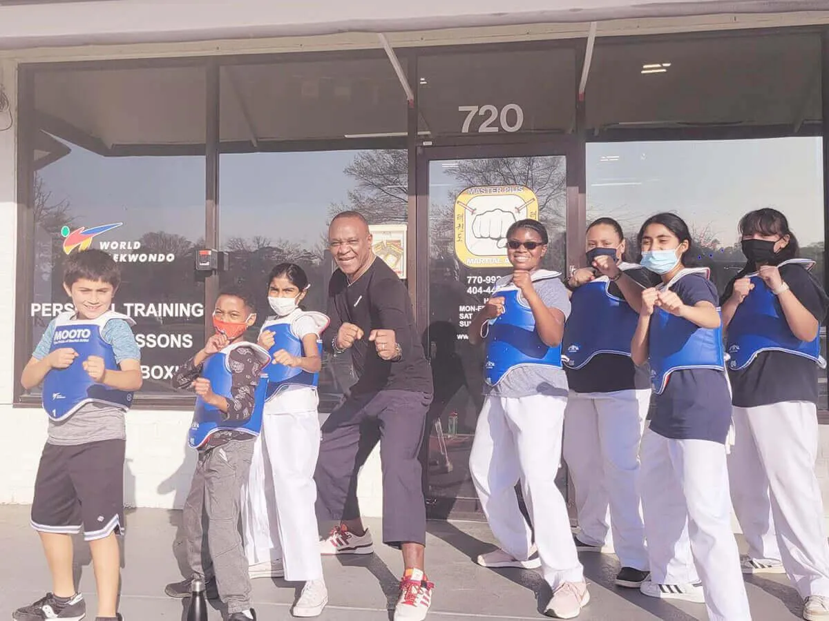Picture of the adult students practicing taekwondo