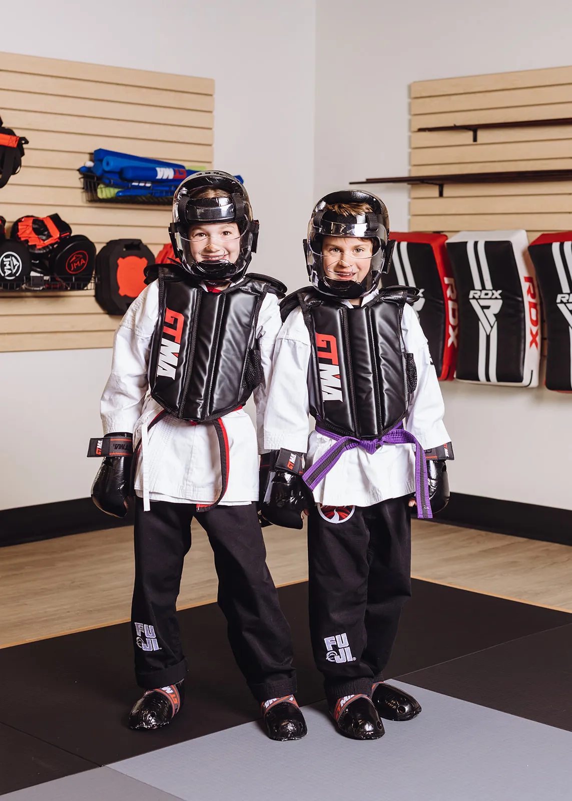 Young girl in a martial arts class practicing a punch