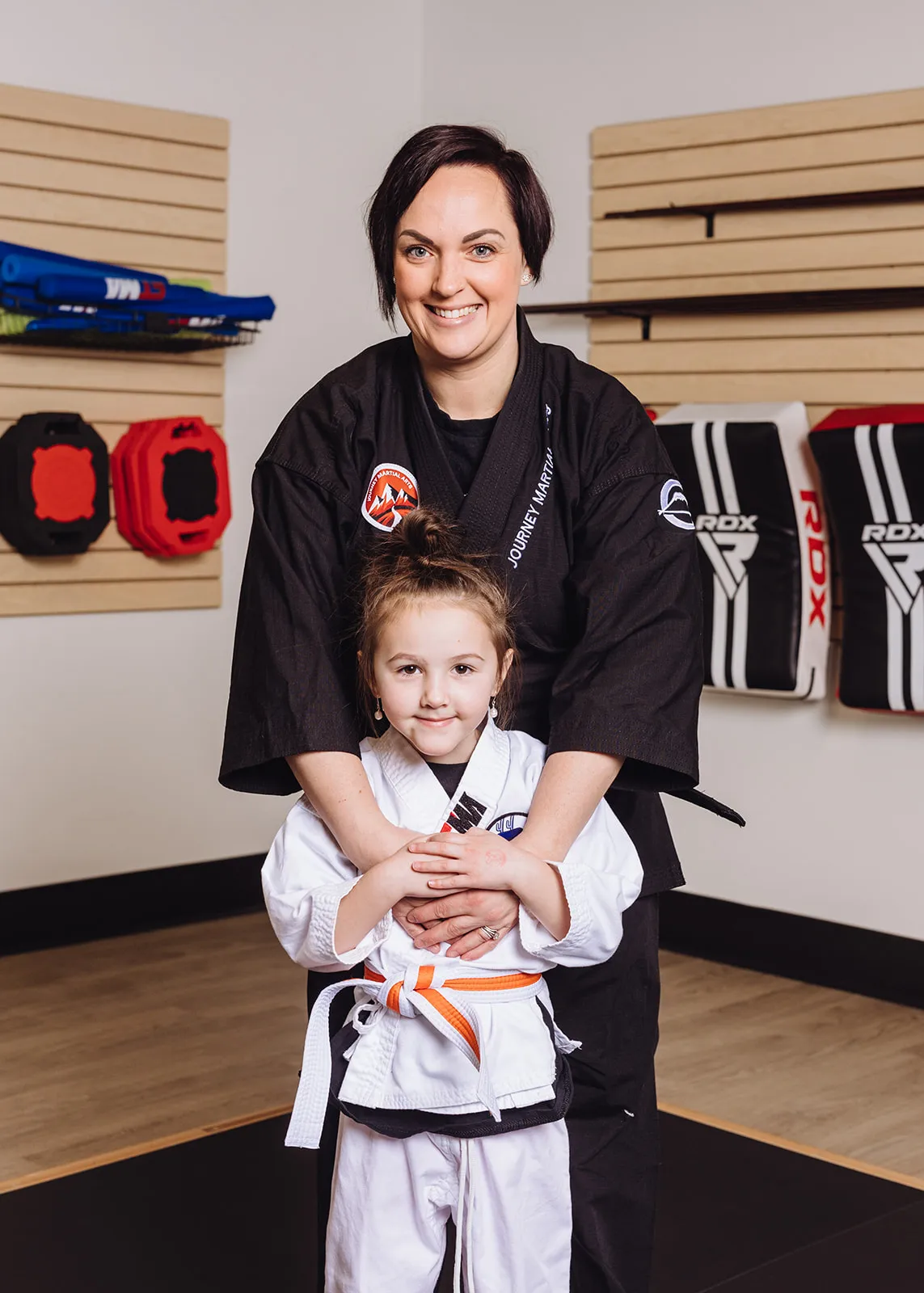 Preschool martial arts student practicing kick