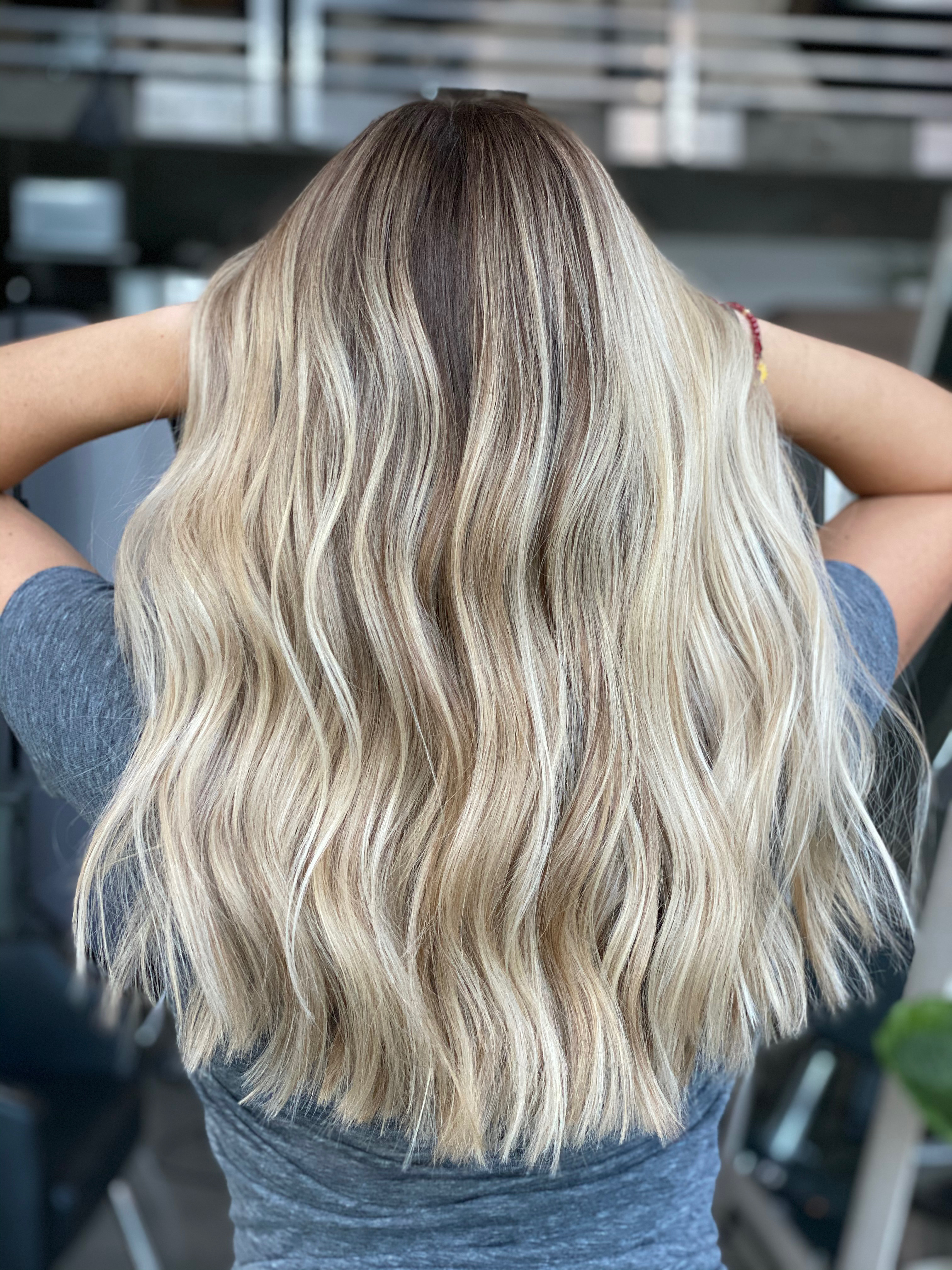 Woman's hands with rings on white dress