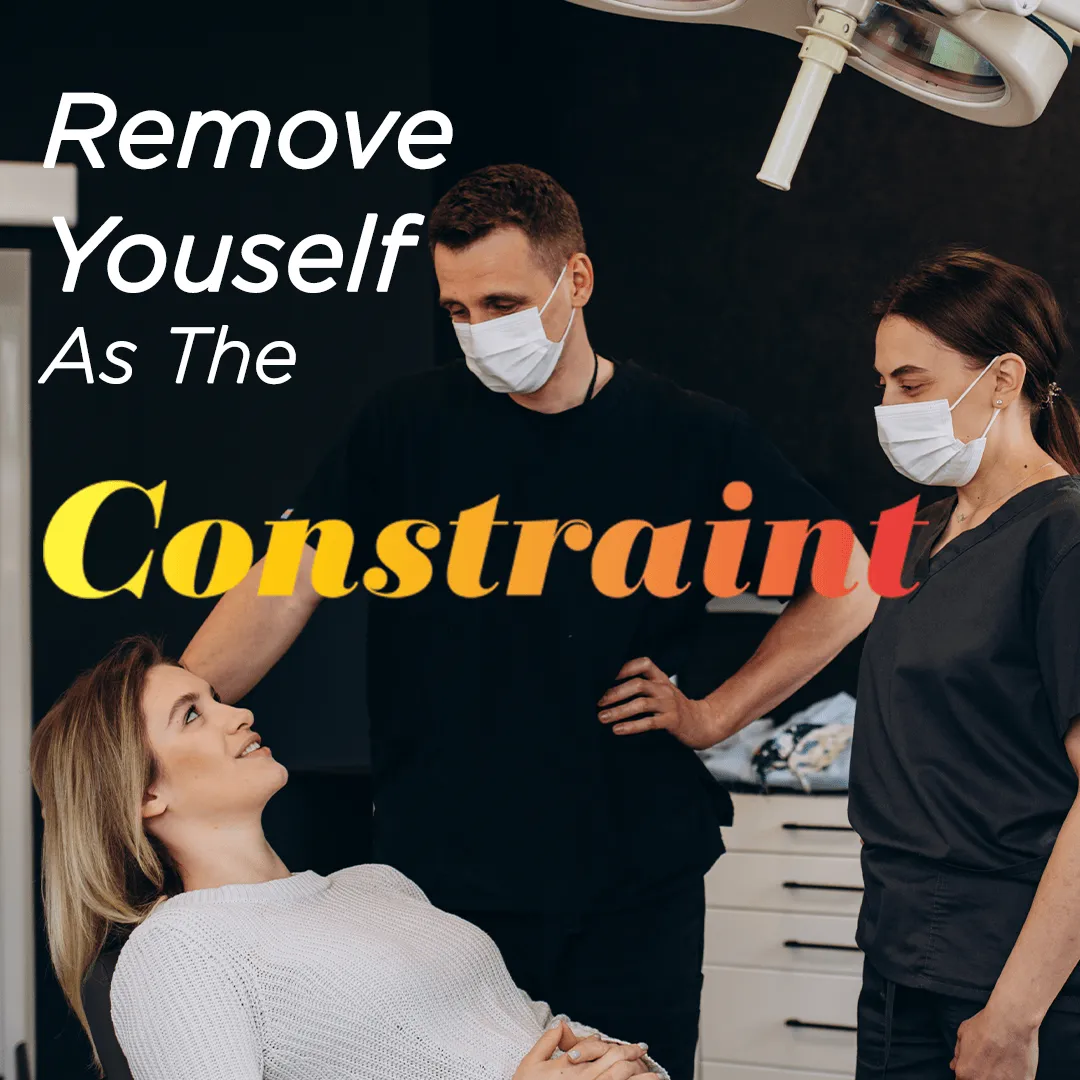 Doctor and Dental Assistant Standing Over Patient
