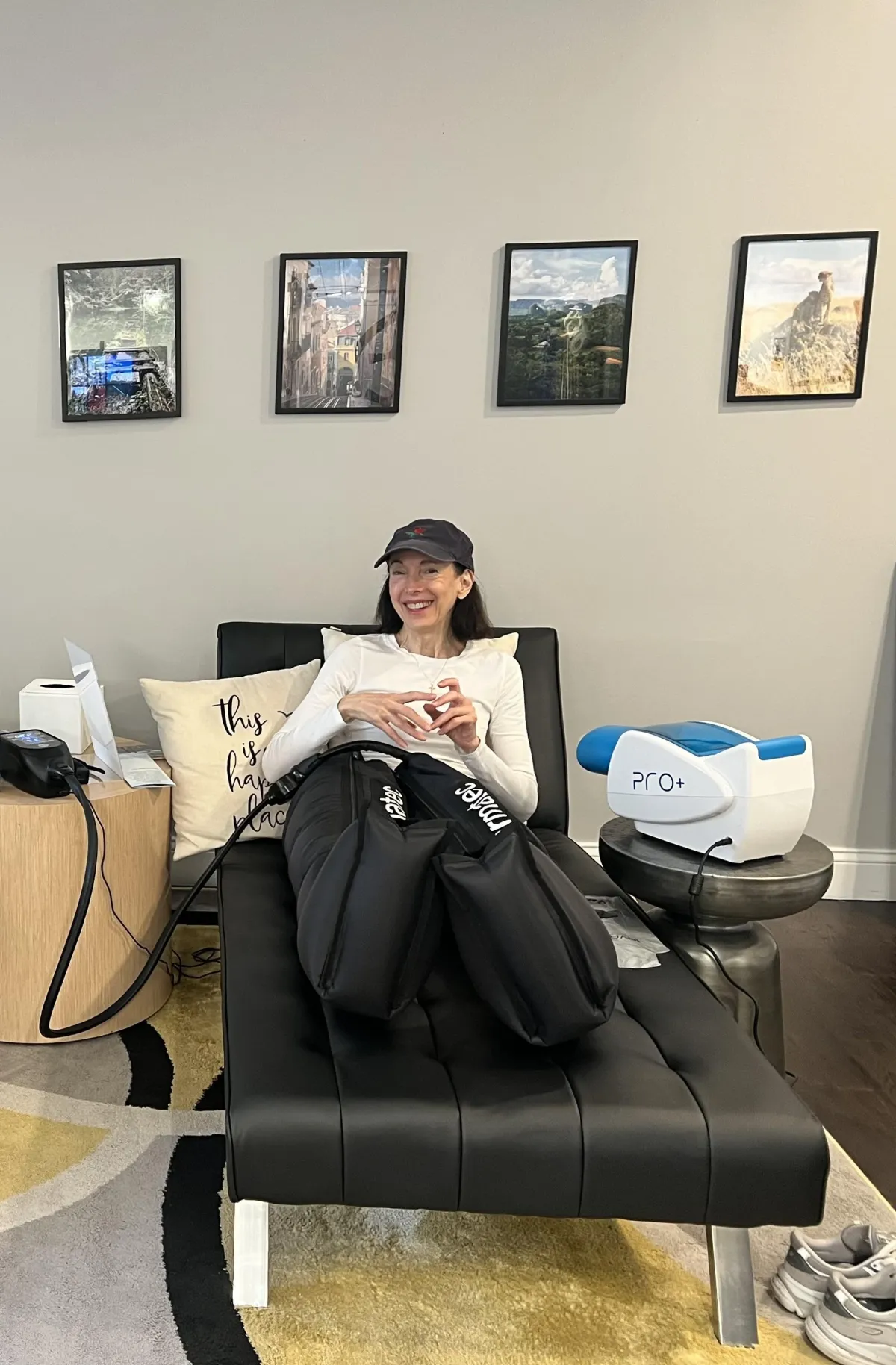 Man relaxing in NormaTec compression boots for leg recovery and circulation therapy Upper West Side NYC