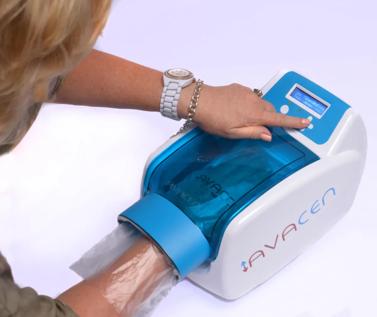 Woman using Avacen heat therapy device for circulation treatment at OsteoStrong Upper West Side NYC