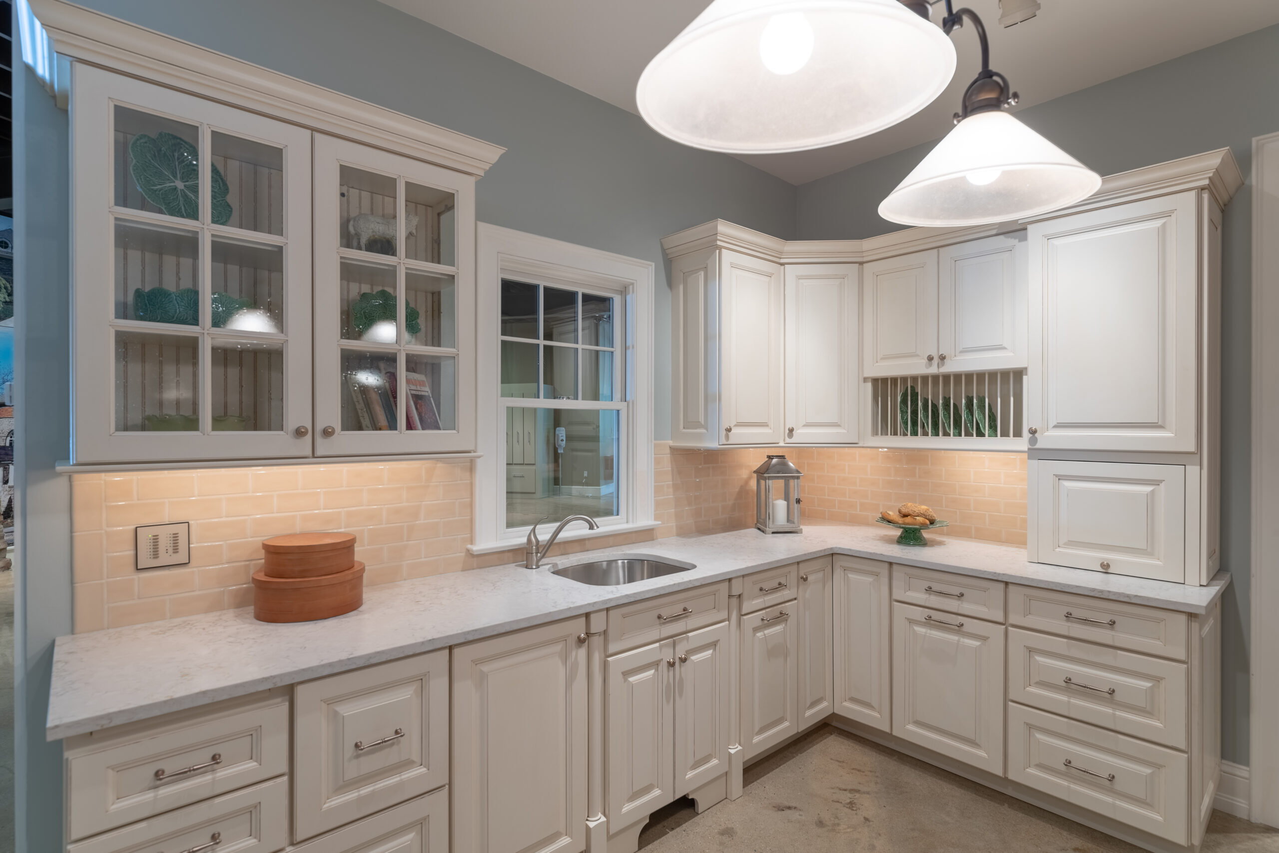 Williamsburg Kitchen & Bath Remodel team designing an open-concept kitchen with elegant lighting and island seating