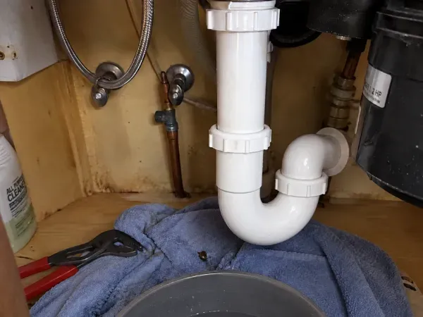 Bathroom faucet running water during a plumbing service