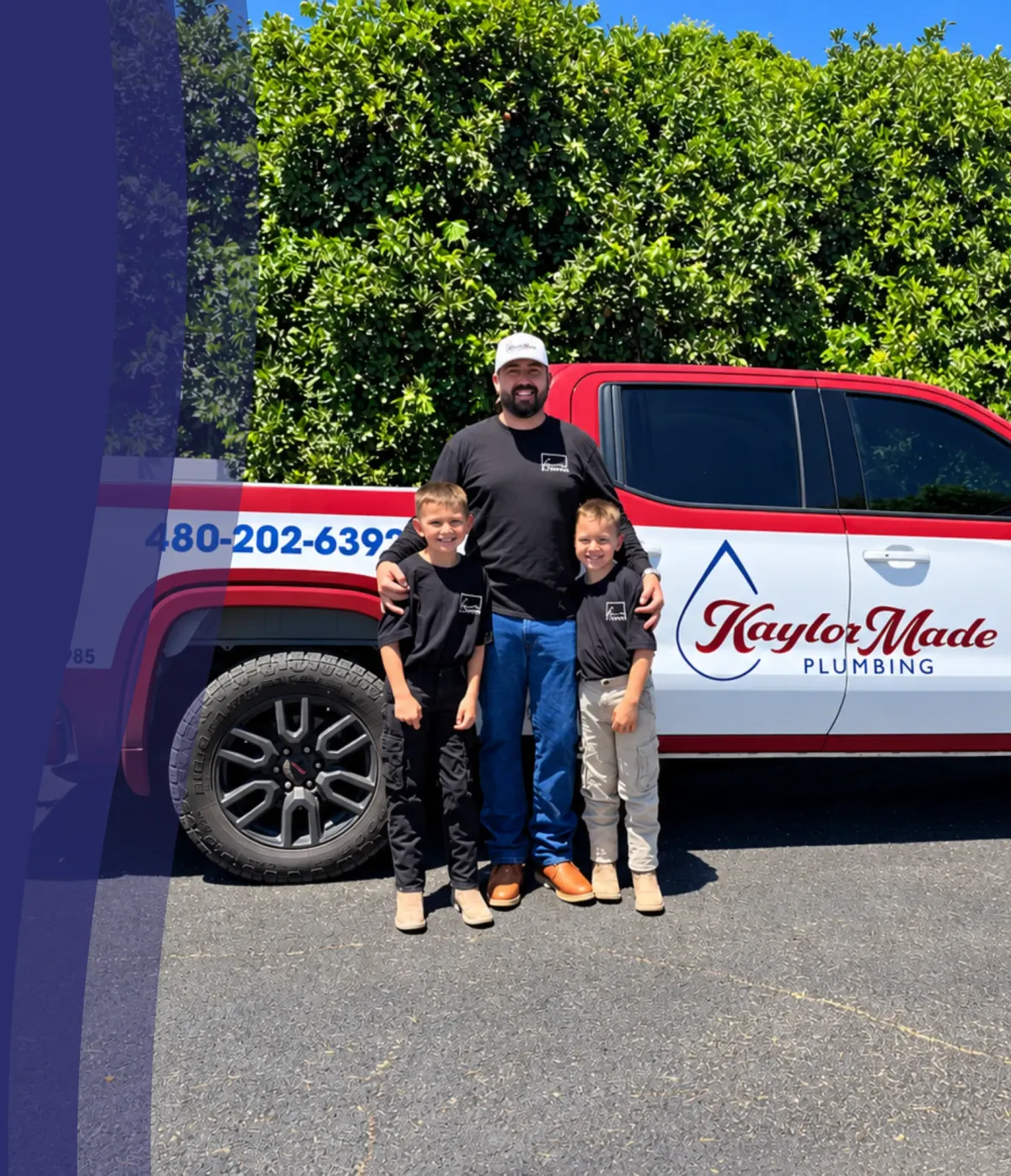KaylorMade Plumbing owner with children standing in front of the company’s branded service truck