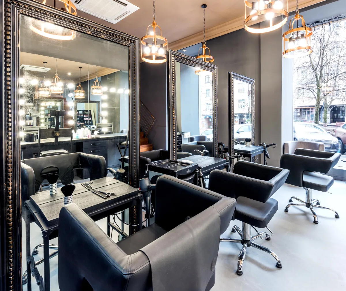 Stylish epoxy flooring in a modern hair salon in Bradenton, Florida, providing a sleek, easy-to-clean surface designed to withstand daily use