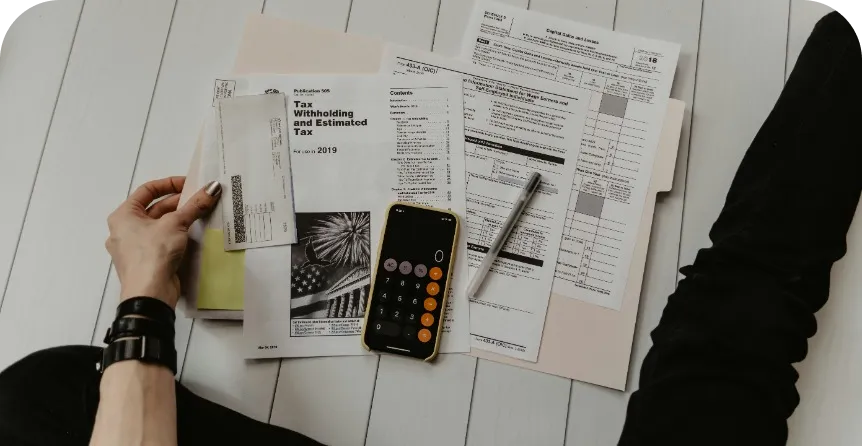 Tax documents spread out on a desk