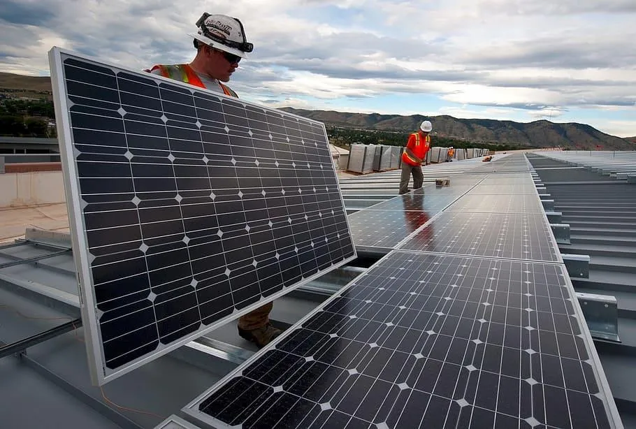 Techs installing solar panels