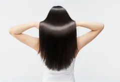 Dermatology clinic scene with notes on hair transplant consultation and improved scalp density.