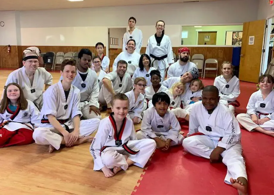 People of all ages and genders taking taekwondo lessons