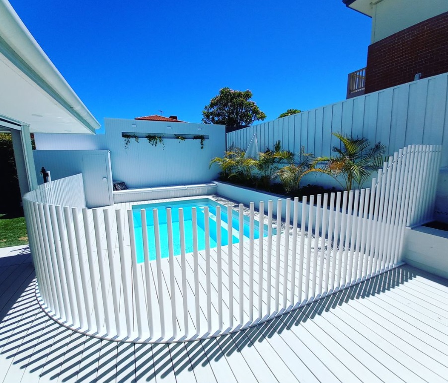 Full-bleed photo of a secure pool fence