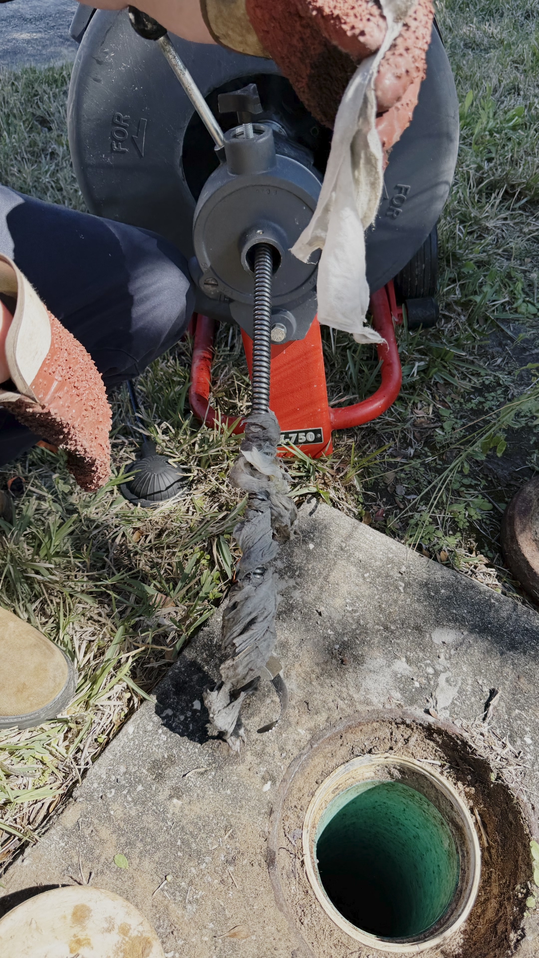 Professional plumber analyzing drain cleaning methods