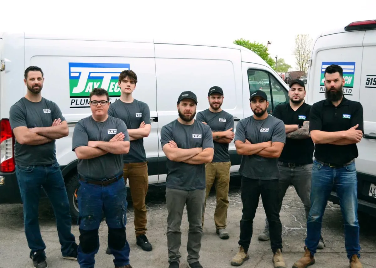 Jaytech Plumbing team in front of branded trucks in Southern Ontario, ready for fast, quality service in Guelph and Kitchener.