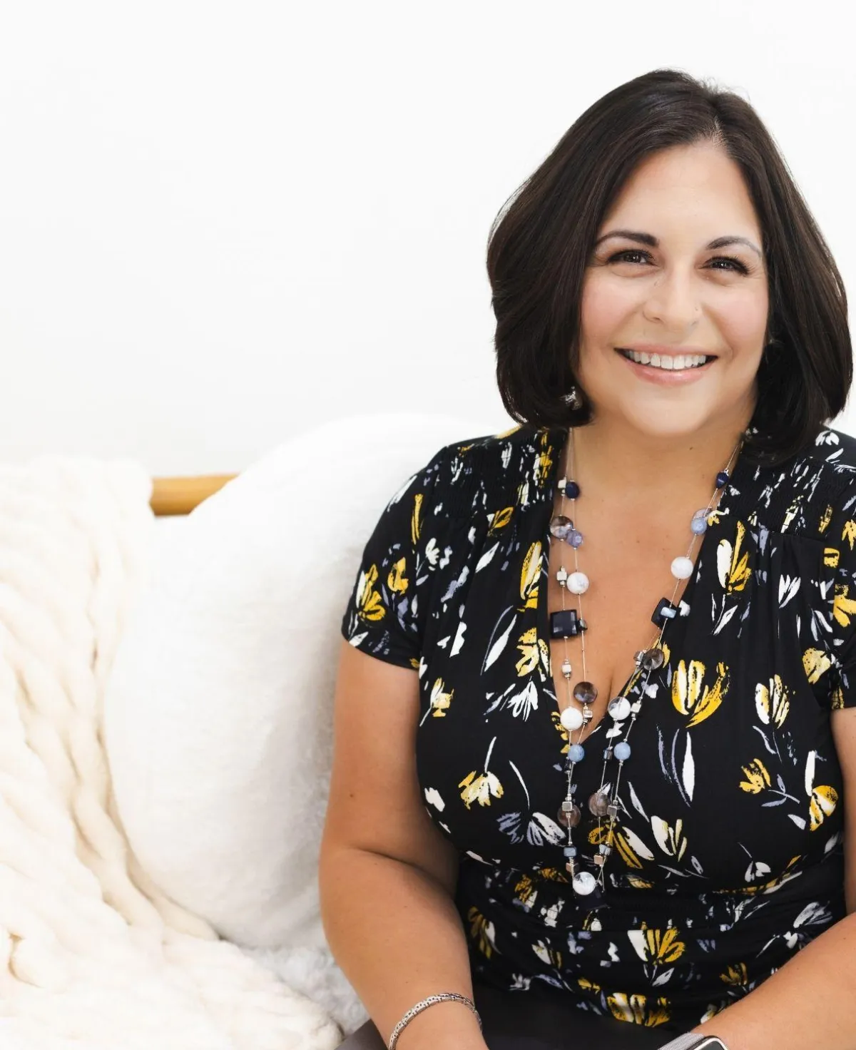 woman in black shirt smiling