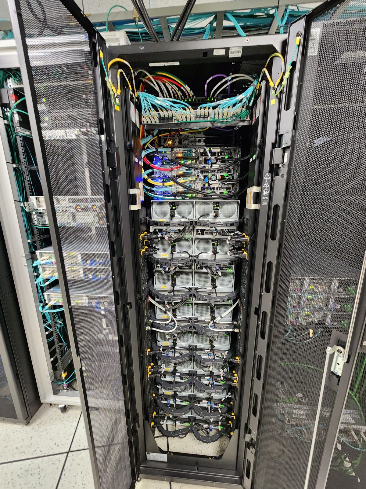 Data center rack with dressed fiber and copper cabling by All Soul Tech